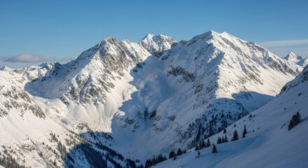 Naklejka premium Stunning snow covered mountain peaks under bright blue winter sky
