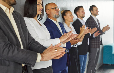 Applause of professional staff group standing by office wall on meeting, business presentation....