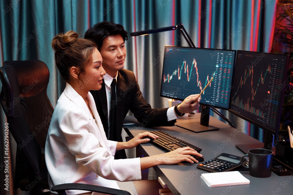 Aufkleber smiling asian business traders pointing to dynamic stock exchange data screen profit value online we