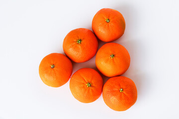 Fresh, ripe mandarin oranges, isolated on a white background.