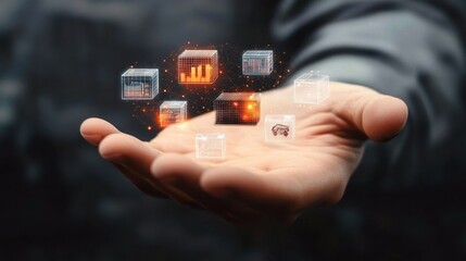 Open hand holding various glowing digital cubes with graphs and icons symbolizing data and technology