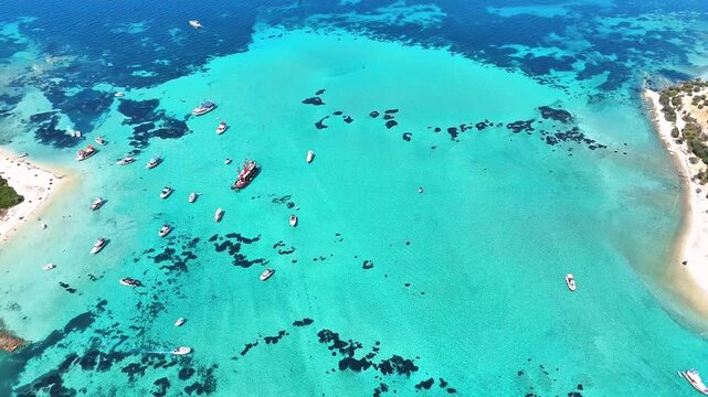 4k drone video of Garip and Kalem islands with turquoise sea and coral reefs in Bademli. Dikili, a district of Izmir famous for its turquoise sea in Turkiye.
