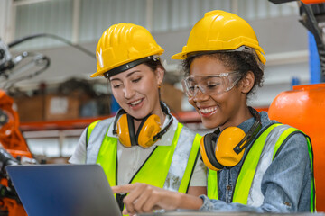 robotic engineer training, technician work in factory industry robot welding arm machine control