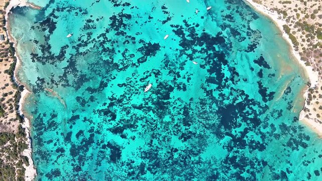 4k drone video of Garip and Kalem islands with turquoise sea and coral reefs in Bademli. Dikili, a district of Izmir famous for its turquoise sea in Turkiye.