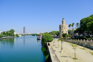 Golden Tower (Torre del Oro) with Guadalquivir River in Seville during a Sunny Day, Andalusia, Spain 