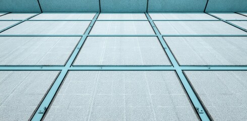 Light-gray square tiles with teal-colored gridlines
