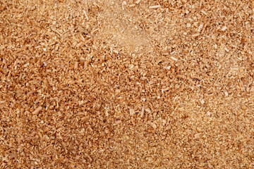 An overhead, macro shot of a pile of light-colored wood shavings. This image captures the intricate spiral patterns and fine textures, perfect for conveying a sense of craftsmanship, natural material,
