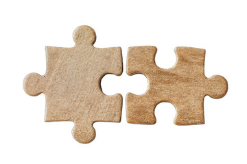 Fototapeta premium Two light brown puzzle pieces joined