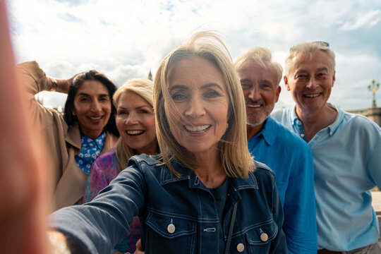 Senior group old buddies reunion in London - Powered by Adobe