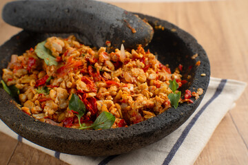 Sambal Tempe served on cobek. Tempe is a traditional food from Indonesia made from soybean. Perfect...