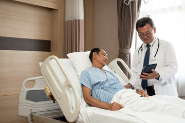Doctor or consulting patient with tablet in checkup for medical results