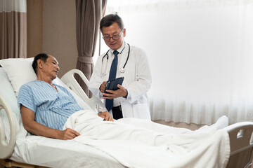 Doctor or consulting patient with tablet in checkup for medical results