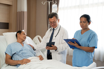 Doctor or consulting patient with tablet in checkup for medical results