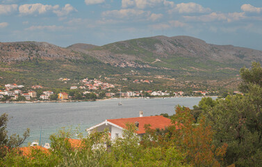 Idyllic summer seascape with mountains in the background.
