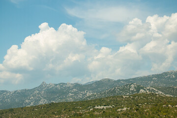 Idyllic summer mountain landscape with beautiful clouds in the background