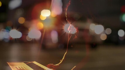 Female musician striking opening chord on keyboard shaping melody amid bokeh lights for night music - Powered by Adobe