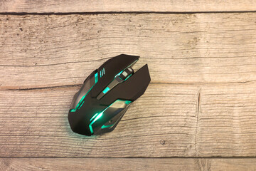 Gaming Mouse with RGB light on wooden table