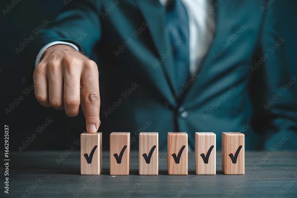 Poster a business person's hand pointing to a wooden block with a check mark in a row of other blocks