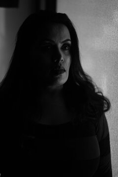 Athletic Female Bodybuilder in Black and White Silhouette Pose