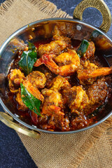 Authentic Kerala style prawn ghee roast, spicy South Indian seafood delicacy made with fresh prawns, clarified butter, roasted spices and curry leaves, traditional Malabar coastal dish