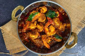 Authentic Kerala style prawn ghee roast, spicy South Indian seafood delicacy made with fresh prawns, clarified butter, roasted spices and curry leaves, traditional Malabar coastal dish