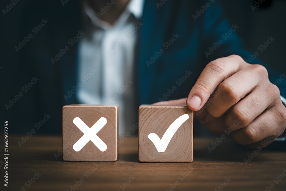 Poster a person's hand choosing a wooden block with a check mark next to a block with an x symbol on it