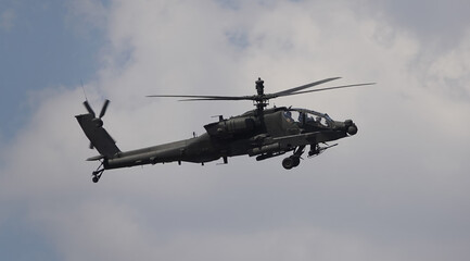 military helicopter in flight