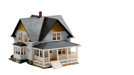 Model House: A quaint, detailed miniature house against a simple backdrop, perfect for illustrating concepts of real estate, home ownership, and architectural design.