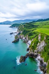 Obraz premium Aerial View of Lush Green Cliffs and Turquoise Ocean