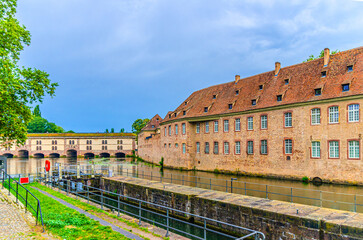 St John's Commandery Commanderie Saint Jean and Barrage Vauban Dam Great Lock bridge, weir and defensive work on River Ill in old town Strasbourg city historic centre, Alsace Grand Est region, France