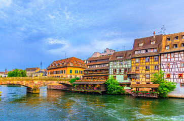 Strasbourg city historic centre, The Petite France Quarter with buildings colorful houses and Pont Saint-Martin bridge across River Ill canal in old town Centre, Alsace Grand Est region, France
