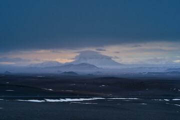 Iceland landscape view with layer of mountain with cloud and mist along the road way for road trip by ring road plan to travel Iceland.