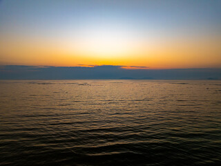 Aerial view sunset sky,Nature beautiful Light Sunset or sunrise over sea,Colorful dramatic sunset Sky, Amazing clouds and waves in sunrise sky golden light cloud background