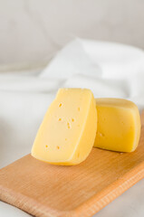 Set of various cheeses on wooden board. Large assortment of craft cheese specialities.