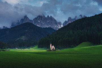 alps church in landscape with mountains and clouds