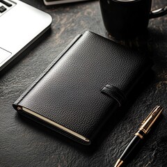 Notebook with pen on top on wooden surface