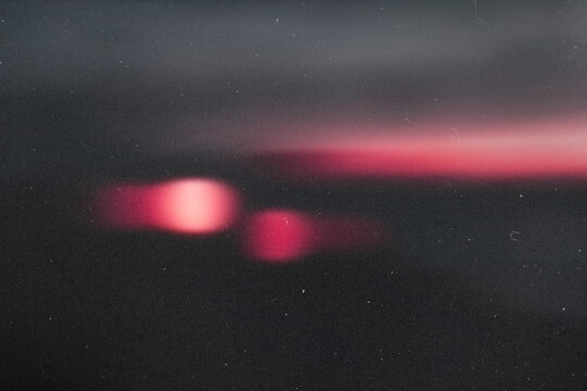 light leak overlay effect with scratch dust and blur light leaks,retro noisy film texture light leak flare on black background,abstract background with red bokeh,grunge film strip background