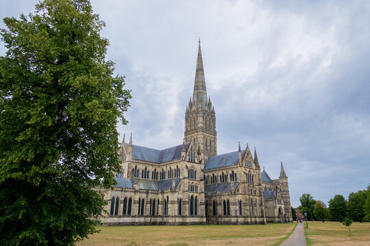 Salisbury UK: 27th July 2025: Salisbury Cathedral towers elegantly, showcasing its spires and intricate design on a quiet monring in Salisbury, England
