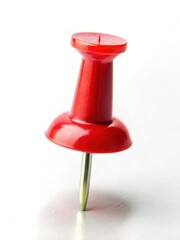Fototapeta premium Small red tack with a pointed tip and flat head on a white background