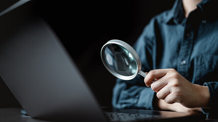 Using magnifying glass web search internet. Magnifier finance audit accounting. Magnifier analyzing...
