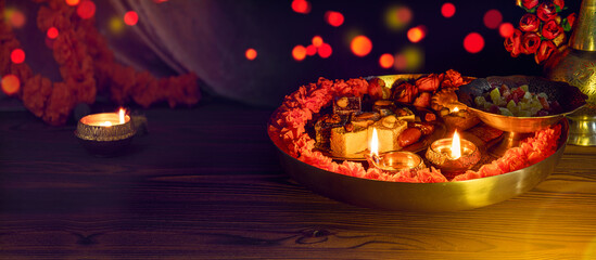 Tray with Diwali treats. Diwali lamp diya or Deepavali or Deepawali. Hindu festival of lights....
