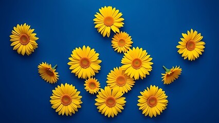 Vibrant yellow gerbera daisies arranged in geometric pattern against deep blue background.