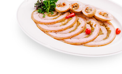 Culinary presentation of rolled meat dish with garnish and peppers