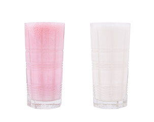 Refreshing pink and white drinks served in tall glasses on a bright surface