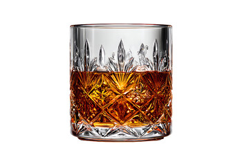 Elegant crystal cut whiskey glass filled with amber spirit isolated on black