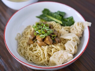 Yamin noodles with dumplings and vegetables for food photography
