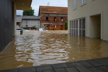Heavy rainfall leads to significant flooding, submerging cars and residential properties in the...