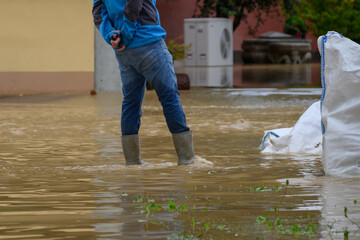 Heavy rain caused significant flooding, submerging residential spaces in standing water, impacting...