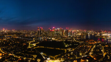 A breathtaking view showcasing London's illuminated skyline at night, highlighting the vibrant city...