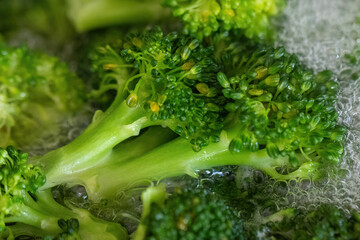 Fresh green broccoli in boiling water.